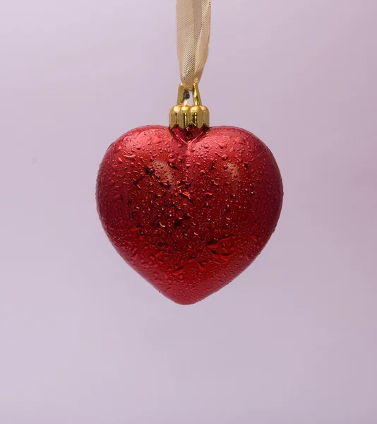 Coração vermelho no fundo rosa — Fotografia de Stock