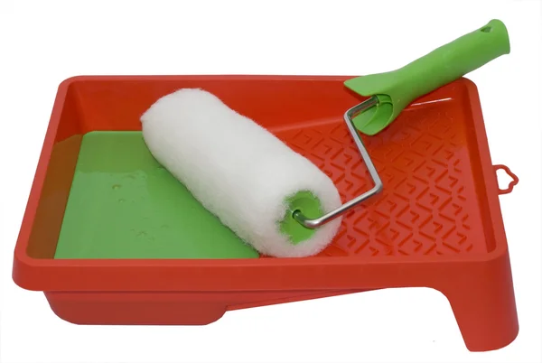 Colorante de rodillo verde en superficie blanca —  Fotos de Stock