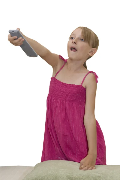 Маленькая девочка нажимает кнопку на удаленной афере — стоковое фото