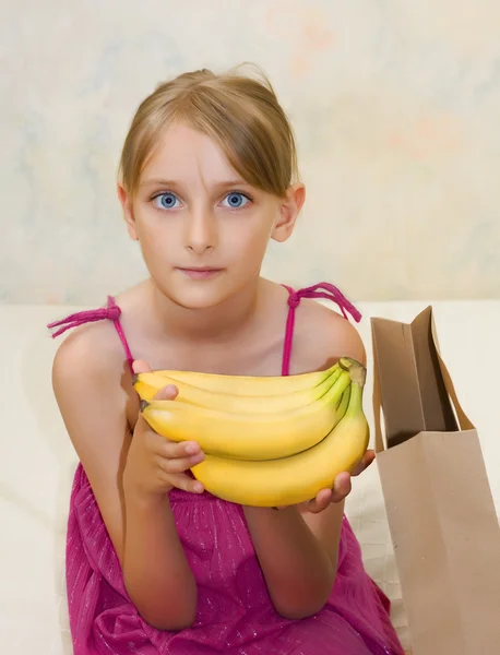 Young beautiful girl with banana — Stock Photo, Image