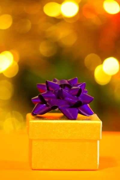 Christmas gift on yellow background — Stock Photo, Image