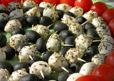 Italian kebabs with cheese and olives clipart