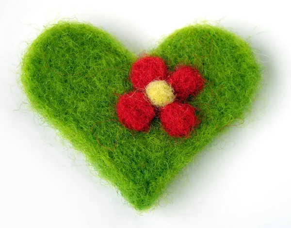 Green felt handmade heart — стокове фото