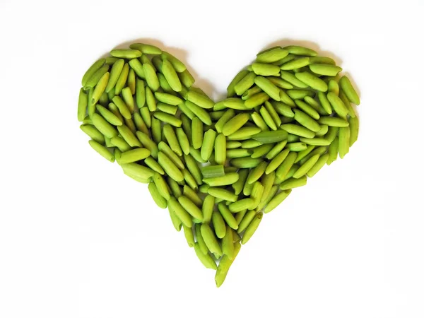 Heart made of green rice — Stock Photo, Image