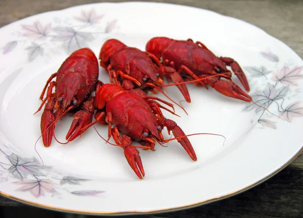 Red cooked crayfish on a plate — Zdjęcie stockowe