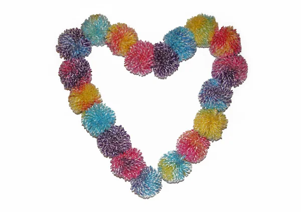 Colorful heart of thread pompons — Stock Photo, Image