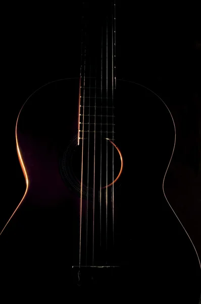 Hat húros gitár ellen egy sötét backgro — Stock Fotó
