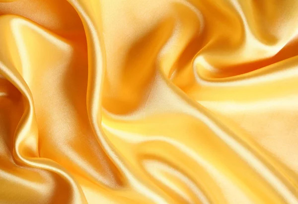 Liscio elegante raso dorato come backgroun — Foto Stock