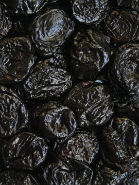 Dry plums or prunes fruit as background clipart