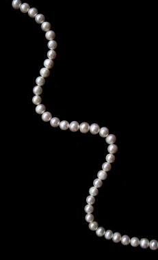 White pearls on the black silk as backgr clipart