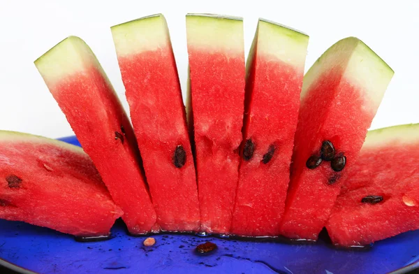 Slices of juicy watermelon served on blu — Stock Photo, Image