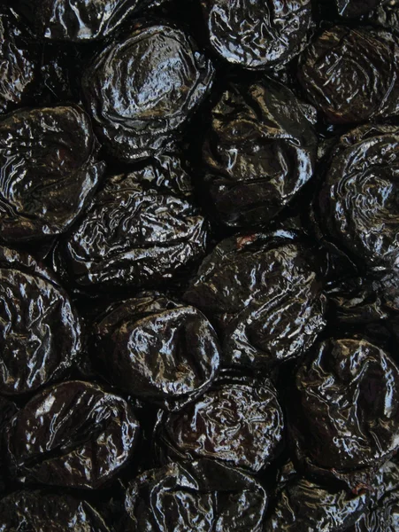 Сухие сливы или чернослив фрукты в качестве фона — стоковое фото