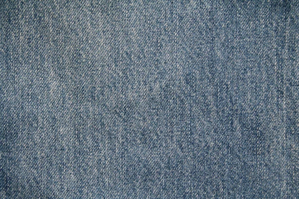 Синие джинсы в качестве фона — стоковое фото