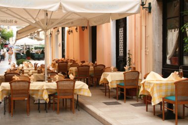 Greece. Corfu island. An open-air cafe clipart