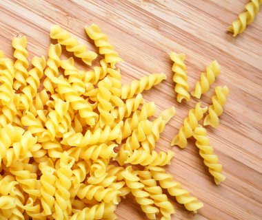 Pasta fusili as background clipart