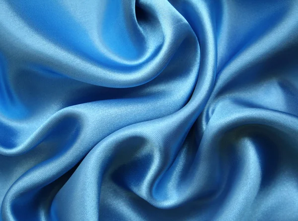 Gładkie elegancki jedwab niebieski jako tło — Zdjęcie stockowe