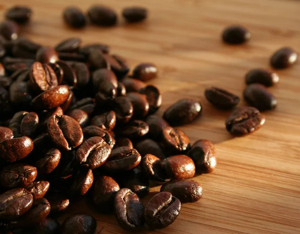 Heap of burnt brown arabica coffee beans — Stock Photo, Image