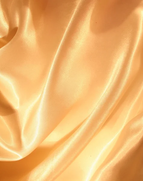 Ομαλή κομψό χρυσό μετάξι ως φόντο — Φωτογραφία Αρχείου