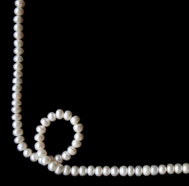 White pearls on the black background clipart