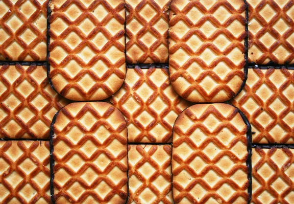 Biscoitos doces com chocolate como backgrou — Fotografia de Stock