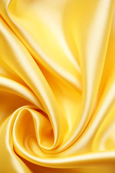 Hladké elegantní zlatý satén — Stock fotografie