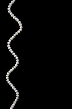 White pearls on the black silk clipart