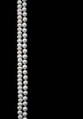 White pearls on the black silk clipart