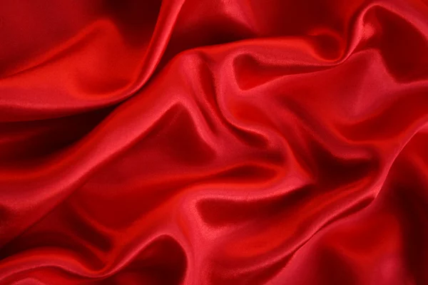 Gładkie elegancki czerwony jedwab jako tło — Zdjęcie stockowe
