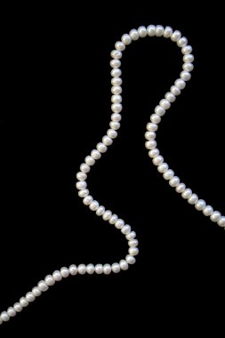 White pearls on the black silk clipart