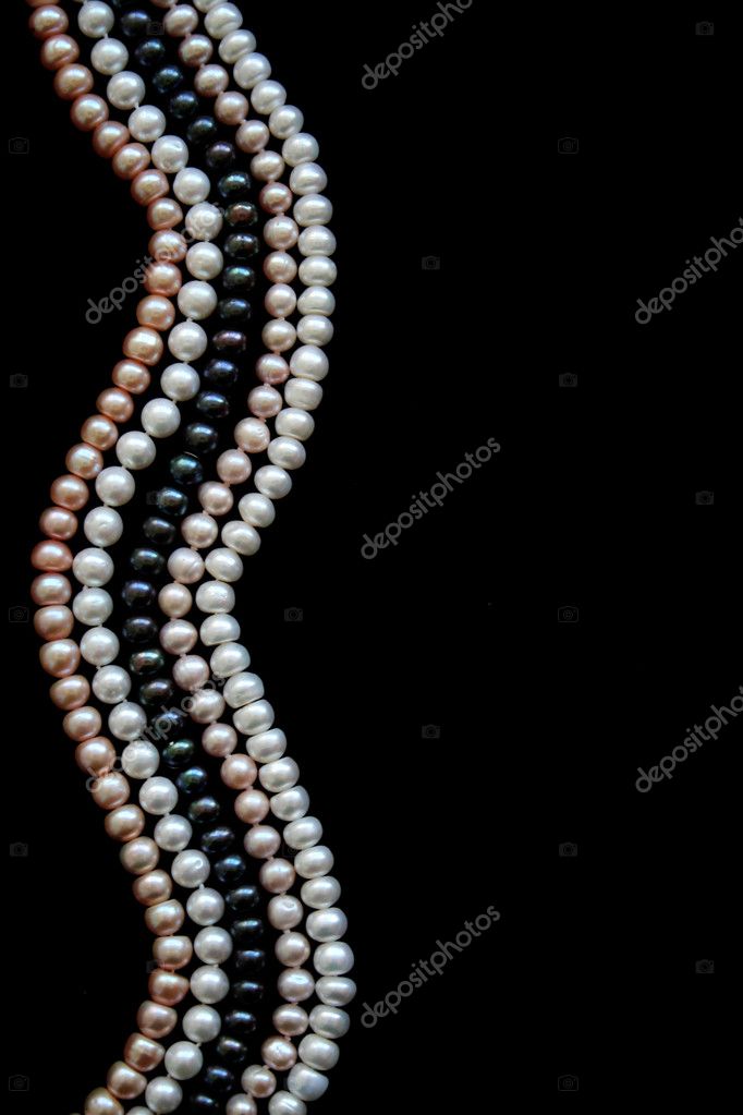 White pearls on the black silk background, Stock image