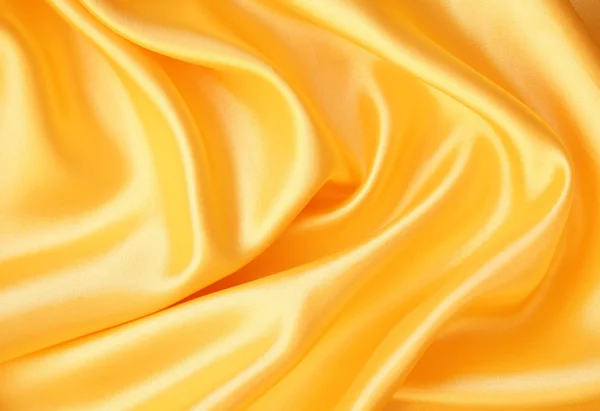 Hladké elegantní zlaté hedvábí — Stock fotografie