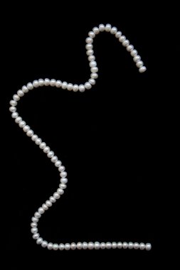 White pearls on the black velvet clipart