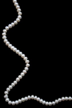 White pearls on the black silk clipart