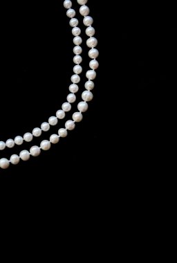 White pearls on the black silk clipart