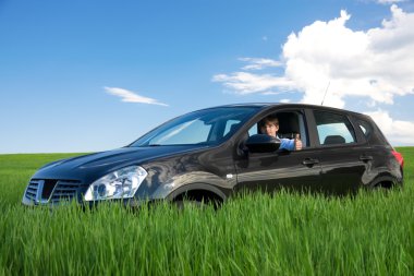 Businessman is thumbs-up in own car clipart