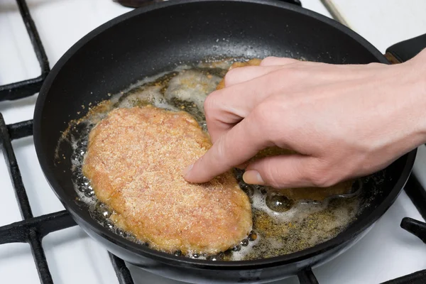 Chicken cutlets roasting on frying-pan — Stock Photo, Image