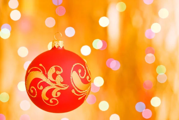 Christmas ornaments over gold background — Stock Photo, Image