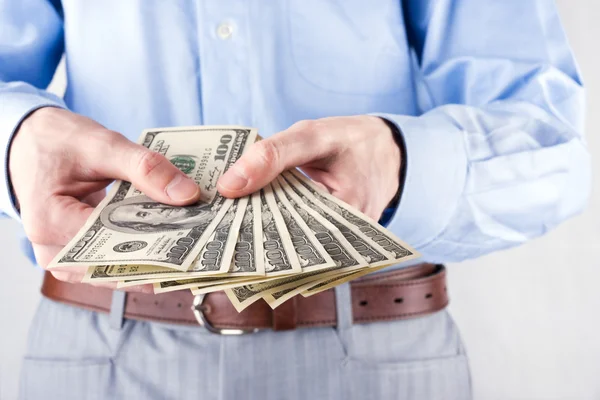 Money in the hands of the businessman — Stock Photo, Image