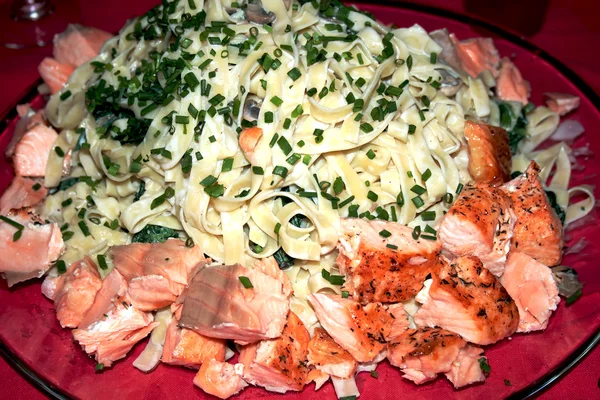 Spaghetti with a salmon — Stock Photo, Image