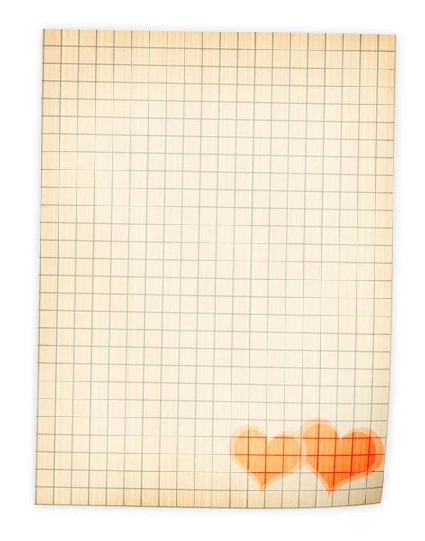 Разлагающийся лист бумаги с красными сердцами — стоковое фото