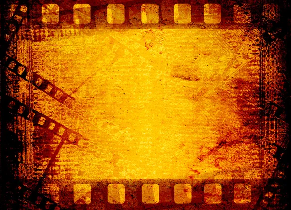 Starý filmový pás na pozadí papíru — Stockfoto