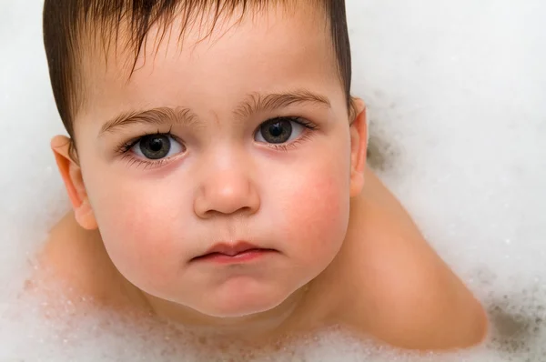 Stock image Serious boy in foam