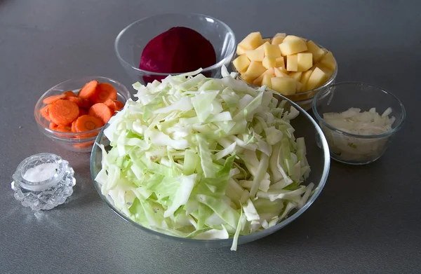 stock image Cuted potato, onion, beet, carrot and ca