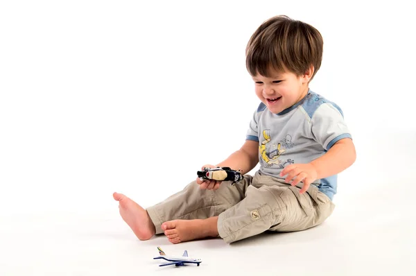 Ευτυχισμένο αγόρι με παιχνίδια — Φωτογραφία Αρχείου