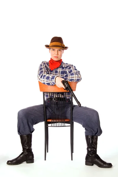Silah oturan kararlı cowgirl — Stok fotoğraf