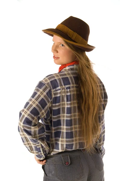 Ung kvinna i cowboy klänning ser tillbaka — Stockfoto