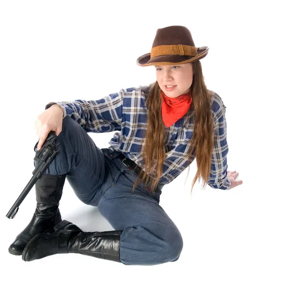 Cowgirl avec pistolet assis et les regards vers le bas — Photo