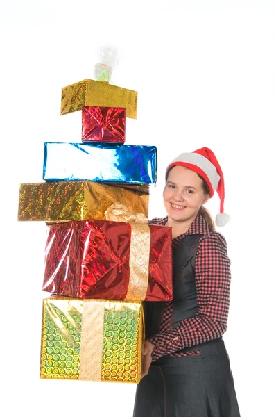 Glad kvinna i röd mössa med gåvor — Stockfoto
