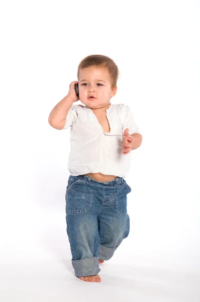 Casual baby med telefon Stockfoto