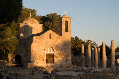 Ancient church and ruins on sunset clipart